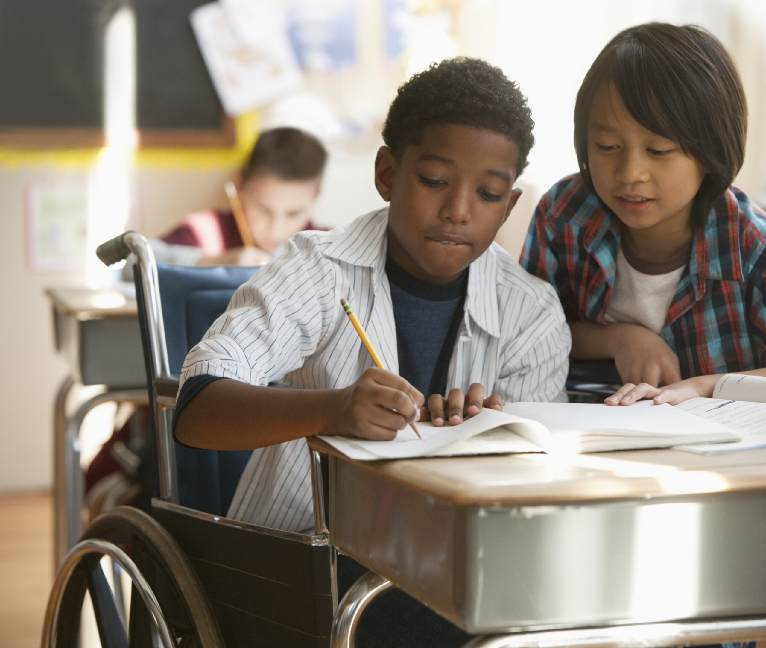 Boys doing schoolwork together